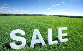Who can buy land from an industrial park?